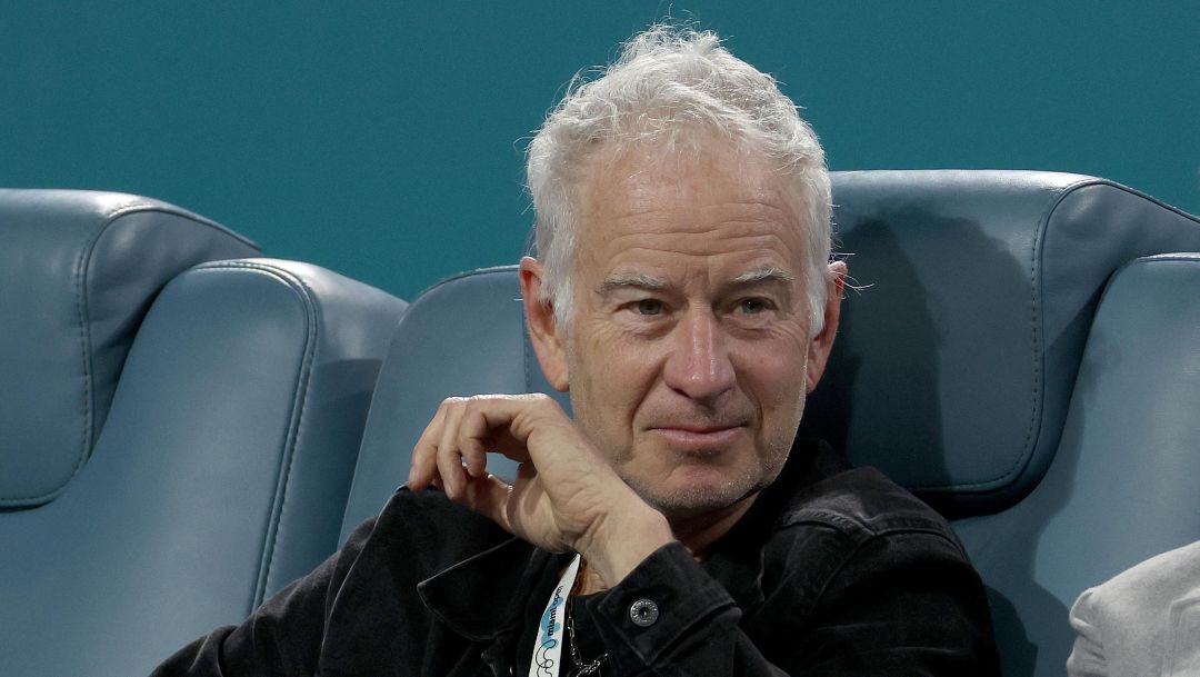 MIAMI GARDENS, FLORIDA - MARCH 30: John McEnroe watches Carlos Alcaraz of Spain play Taylor Fritz of the United States during the quarterfinals of the Miami Open at Hard Rock Stadium on March 30, 2023 in Miami Gardens, Florida.   Matthew Stockman/Getty Images/AFP (Photo by MATTHEW STOCKMAN / GETTY IMAGES NORTH AMERICA / Getty Images via AFP)