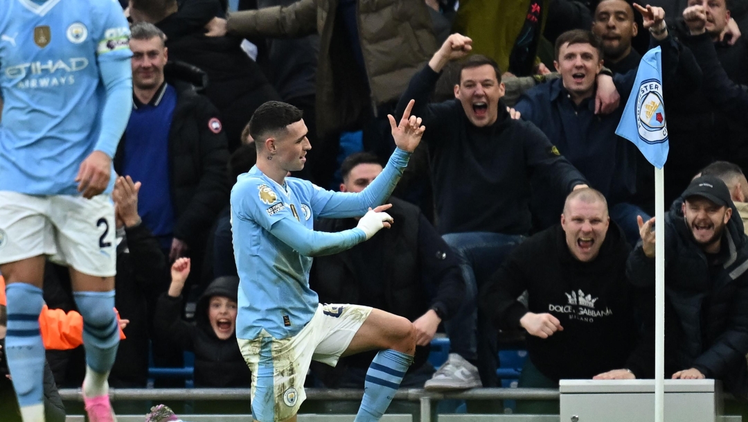 Manchester City's English midfielder #47 Phil Foden celebrates after scoring their second goal during the English Premier League football match between Manchester City and Manchester United at the Etihad Stadium in Manchester, north west England, on March 3, 2024. (Photo by Paul ELLIS / AFP) / RESTRICTED TO EDITORIAL USE. No use with unauthorized audio, video, data, fixture lists, club/league logos or 'live' services. Online in-match use limited to 120 images. An additional 40 images may be used in extra time. No video emulation. Social media in-match use limited to 120 images. An additional 40 images may be used in extra time. No use in betting publications, games or single club/league/player publications. /