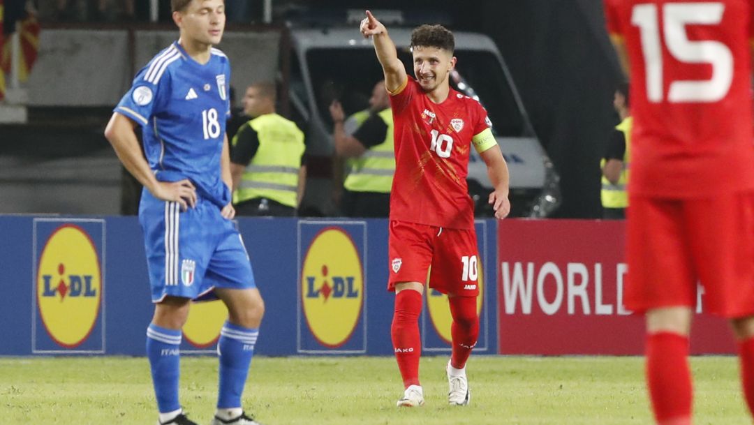North Macedonia's Enis Bardhi, center, celebrates after he scored his side's first goal during the Euro 2024 group C qualifying soccer match between North Macedonia and Italy at National Arena Todor Proeski in Skopje, North Macedonia, Saturday, Sept. 9, 2023. (AP Photo/Boris Grdanoski)