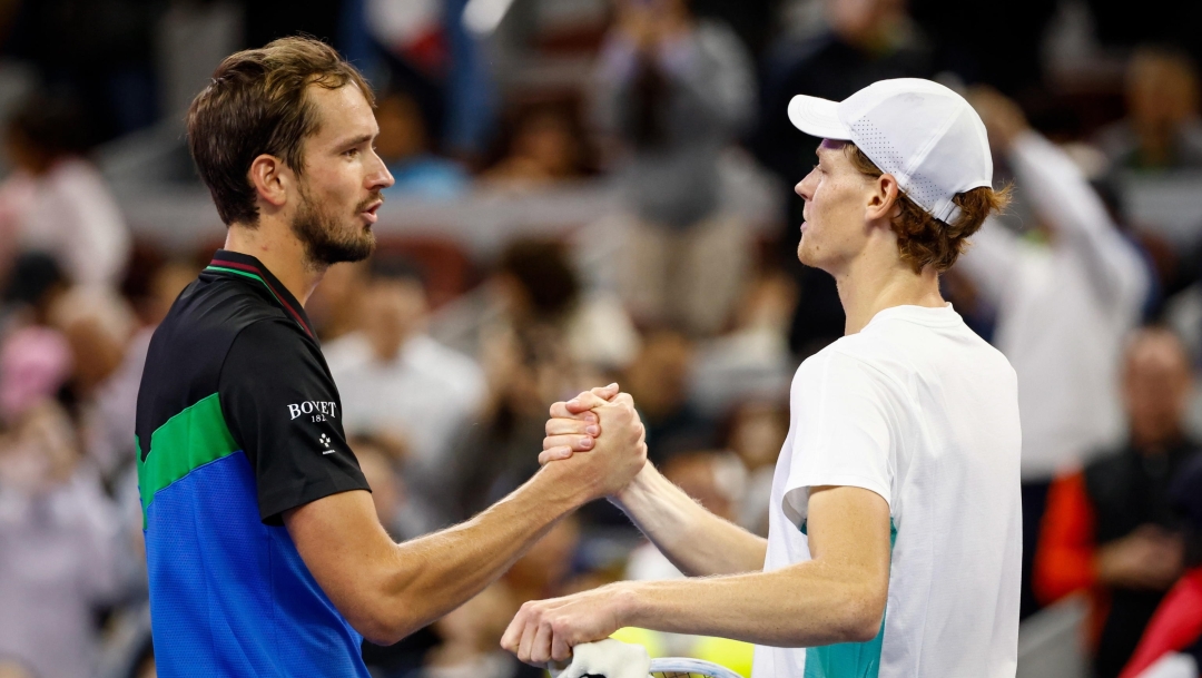 epa10899521 Jannik Sinner (R) of Italy shakes hands with Daniil Medvedev (L) of Russia after winning  their Men's Singles Final match at the China Open tennis tournament in Beijing, China, 04 October 2023.  EPA/MARK R. CRISTINO