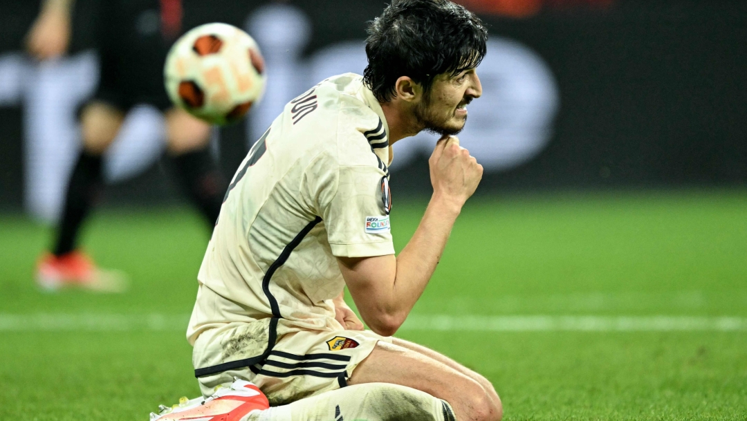 Roma's Iranian forward #17 Sardar Azmoun sits on the pitch during the UEFA Europa League semi final second leg football match between Bayer Leverkusen and ASC Roma in Leverkusen, on May 9, 2024. (Photo by INA FASSBENDER / AFP)
