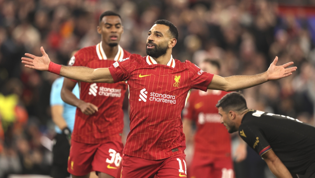 Liverpool's Mohamed Salah celebrates after scoring his side's second goal during the Champions League soccer match between Liverpool and Bologna at the Anfield stadium in Liverpool, England, Wednesday, Oct. 2, 2024. (AP Photo/Ian Hodgson)