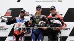 Second placed Johann Zarco of France, winner Fabio Quartararo of France and third placed Aleix Espargaro of Spain, from left to right, pose on the podium of the MotoGP race of the Algarve Motorcycle Grand Prix, at the Algarve International circuit near Portimao, Portugal, Sunday, April 24, 2022. (AP Photo/Jose Breton)