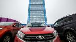 A Lada car is seen parked in front of the administrative building of the Avtovaz automobile plant in Tolyatti, also known as Togliatti, on March 31, 2022. - For generations the Russian city of Tolyatti has been synonomous with the maker of one of the country's best-known brands -- the Lada automobile. But with the West piling sanctions on Russia over its military action in Ukraine, Tolyatti and the workers of Avtovaz are bracing for tough times. (Photo by Yuri KADOBNOV / AFP)