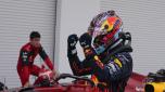 Red Bull driver Max Verstappen of the Netherlands celebrates after winning the Formula One Miami Grand Prix auto race over second placer finisher Ferrari driver Charles Leclerc of Monaco, left, at the Miami International Autodrome, Sunday, May 8, 2022, in Miami Gardens, Fla. (AP Photo/Darron Cummings)