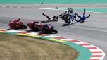 Spain's rider Alex Rins of the Team SUZUKI ECSTAR, top right, and Japan's rider Takaaki Nakagami of the LCR Honda IDEMITSU and Italian rider Francesco Bagnaia of the Ducati Lenovo Team, left, fall down during the MotoGP race of the Catalunya Motorcycle Grand Prix at the Catalunya racetrack in Montmelo, just outside of Barcelona, Spain, Sunday, June 5, 2022. (AP Photo/Joan Monfort)