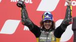 Second placed Italian rider Marco Bezzecchi of the Mooney VR46 Racing Team celebrates with trophy on the podium after the MotoGP race at the Dutch Grand Prix in Assen, northern Netherlands, Sunday, June 26, 2022. (AP Photo/Peter Dejong)