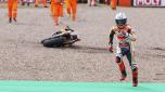 Marc Marquez from Spain runs to get a second bike after falling on his Repsol Honda during qualifying practice for the German Grand Prix at the Sachsenring in  Hohenstein-Ernstthal, Germany, Saturday, June 17, 2023. (Jan Woitas//dpa via AP)