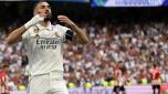 TOPSHOT - Real Madrid's French forward Karim Benzema celebrates scoring a goal from the penalty spot during the Spanish league football match between Real Madrid CF and Athletic Club Bilbao at the Santiago Bernabeu stadium in Madrid on June 4, 2023. (Photo by Pierre-Philippe MARCOU / AFP)