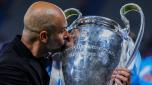 Manchester City's head coach Pep Guardiola kisses the trophy after winning the Champions League final soccer match between Manchester City and Inter Milan at the Ataturk Olympic Stadium in Istanbul, Turkey, Sunday, June 11, 2023. Manchester City won 1-0. (AP Photo/Manu Fernandez)