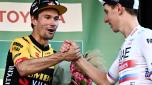 Second-placed Jumbo-Visma's Slovenian rider Primoz Roglic (L) congratulates race winner UAE Team Emirates team's Slovenian rider Tadej Pogacar (R) on the podium after the 117th edition of the Giro di Lombardia (Tour of Lombardy), a 238km cycling race from Como to Bergamo on October 7, 2023. (Photo by Marco BERTORELLO / AFP)