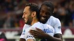 TURIN, ITALY - OCTOBER 21: Hakan Calhanoglu of FC Internazionale celebrates with teammate Marcus Thuram after scoring the team's third goal during the Serie A TIM match between Torino FC and FC Internazionale at Stadio Olimpico di Torino on October 21, 2023 in Turin, Italy. (Photo by Valerio Pennicino/Getty Images)