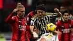 Juventus' Serbian forward #09 Dusan Vlahovic (R) fights for the ball with with AC Milan's Danish defender #24 Simon Kjaer during the Italian Serie A football match between Milan and Juventus at San Siro Stadium, in Milan on October 22, 2023. (Photo by Marco BERTORELLO / AFP)