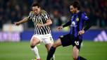 Juventus' Italian forward #07 Federico Chiesa (L) and Inter Milan's Italian defender #36 Matteo Darmian (R) fight for the ball during the Italian Serie A football match between Juventus and Inter Milan at the Allianz Stadium in Turin, on November 26, 2023. (Photo by MARCO BERTORELLO / AFP)