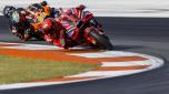 Italian rider Francesco Bagnaia of the Ducati Lenovo Team steers his motorcycle followed by South African rider Brad Binder of the Red Bull KTM Factory Racing during the MotoGP race of the Valencia Motorcycle Grand Prix, the last race of the season, at the Ricardo Tormo circuit in Cheste near Valencia, Spain, Sunday, Nov. 26, 2023. (AP Photo/Alberto Saiz)