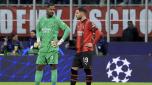 MILAN, ITALY - NOVEMBER 28: Mike Maignan (L) of AC Milan and Theo Hernandez (R) shows his dejection during the UEFA Champions League match between AC Milan and Borussia Dortmund at Stadio Giuseppe Meazza on November 28, 2023 in Milan, Italy. (Photo by Giuseppe Cottini/AC Milan via Getty Images)