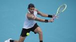 Matteo Berrettini, of Italy, returns a ball in his first round match against Andy Murray, of Britain, at the Miami Open tennis tournament, Wednesday, March 20, 2024, in Miami Gardens, Fla. (AP Photo/Rebecca Blackwell)