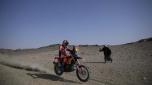 A man takes a photo of Luciano Benavides of Argentina as he rides during the prologue of the Dakar Rally in Bisha, Saudi Arabia, Friday, Jan. 3, 2025. (AP Photo/Christophe Ena)    Associated Press / LaPresse Only italy and Spain