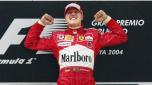 Un esultante Michael Schumacher in rosso Ferrari. Afp
