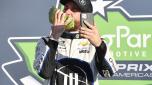 AUSTIN, TEXAS - MARCH 27: Ross Chastain, driver of the #1 ONX Homes/iFly Chevrolet, takes a selfie eating watermelon in victory lane after winning the NASCAR Cup Series Echopark Automotive Grand Prix at Circuit of The Americas on March 27, 2022 in Austin, Texas.   Logan Riely/Getty Images/AFP == FOR NEWSPAPERS, INTERNET, TELCOS & TELEVISION USE ONLY ==