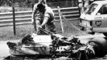 Racing track officials looking at the remains of the Ferrari of Canadian racing driver Gilles Villeneuve during the final qualifying session for the Belgian Grand Prix at Zolder on May 8, 1982. Villeneuve's car touched the rear wheel of Jochen Mass's car, flew in the air and crashed nose first into a sandbank. Villeneuve was pronounced dead on arrival at the hospital. (AP Photo/Heinz Ducklau)