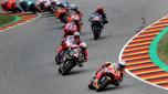 TOPSHOT - Honda Spanish rider Marc Marquez (Front) steers his motorbike during the German MotoGP Grand Prix at the Sachsenring racing circuit in Hohenstein-Ernstthal near Chemnitz, eastern Germany, on June 20, 2021. (Photo by Ronny HARTMANN / AFP)