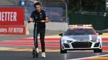 TOPSHOT - Williams' Thai driver Alexander Albon rides a scooter on the track ahead of the Formula One Grand Prix at the Spa-Francorchamps racetrack Spa on August 25, 2022. - The Formula One Belgian Grand Prix will take place on August 28, 2022. (Photo by JOHN THYS / AFP)