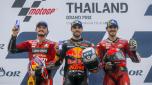 epa10219124 (L-R) Runner-up Australian MotoGP rider Jack Miller of Ducati Lenovo Team, winner Portuguese MotoGP rider Miguel Oliveira of Red Bull KTM Factory Racing, and third placed Italian Moto GP rider Francesco Bagnaia of Ducati Lenovo Team celebrate on the podium at the end of the Motorcycling Grand Prix of Thailand at Chang International Circuit, Buriram province, Thailand, 02 October 2022.  EPA/DIEGO AZUBEL