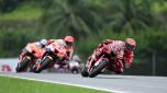 Ducati Lenovo's Italian rider Francesco Bagnaia (R) speeds ahead of Repsol Honda's Spanish rider Marc Marquez during the first MotoGP qualifying session at the Sepang International Circuit in Sepang on October 22, 2022, ahead of the Malaysian Grand Prix. (Photo by MOHD RASFAN / AFP)