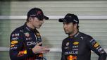 Red Bull driver Max Verstappen of the Netherlands, left and Red Bull driver Sergio Perez of Mexico stand after qualifying session for the Formula One Abu Dhabi Grand Prix, in Abu Dhabi, United Arab Emirates Saturday, Nov.19, 2022. (AP Photo/Kamran Jebreili, Pool)