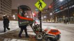 A man uses a snow blower to clear a sidewalk during a winter storm ahead of the Christmas Holiday outside the Union Station, in Chicago on December 22, 2022. - More than 2,200 flights were canceled across the United States by Thursday afternoon as a massive winter storm named Elliot upended holiday travel plans with a triple threat of heavy snow, howling winds and bitter cold (Photo by KAMIL KRZACZYNSKI / AFP)