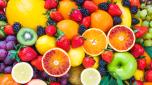 Fresh mixed fruits background.Organic fruits multicolore background.