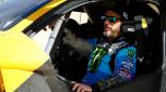 (FILES) In this file photo taken on January 17, 2020, legendary off-road racer and YouTube star Ken Block prepares to take the wheel of Extreme Es E-SUV to take part in the Grand Prix of Qiddiya finale of the Dakar 2020. - The American rally driver Ken Block, a YouTube star best known for his spectacular demonstrations at the wheel of cars in urban environments, was killed while riding a snowmobile in Utah, his sports team announced on December 2, 2023. (Photo by FRANCK FIFE / AFP)