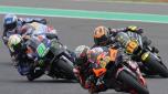 South Africa's Brad Binder rides his KTM chased by Italy's Luca Marini on his Ducati, right, and Italy's Franco Morbidelli on his Yamaha, left, during the Moto GP sprint race in Termas de Rio Hondo, Argentina, Saturday, April 1, 2023. (AP Photo/Natacha Pisarenko)
