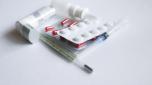 Set of medications - Pills, syringe, inhaler, thermometer, spray on white background