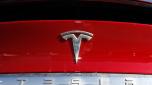 FILE - The Tesla company logo is shown at a Tesla dealership in Littleton, Colo. Feb. 2, 2020. Tesla said in its safety recall report that is recalling nearly 16,000 of its 2021-2023 Model S and Model X vehicles because some front-row seat belts may not have been reconnected properly following a repair. (AP Photo/David Zalubowski, File)