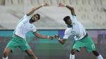 Saudi Arabia's Abdullah Alkhainari. Left and Saudi Arabia's Mohammed Kanno celebrate after a goal during the World Cup 2022 qualifier between China and Saudi Arabia in Sharjah, United Arab Emirates, Thursday, March 24, 2022. (AP Photo/Ebrahim Noroozi)