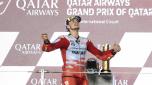Ducati rider Fabio Di Giannantonio, of Italy, celebrate on the podium after winning the Qatari MotoGP Grand Prix at the Lusail International Circuit in Lusail, Qatar, Sunday, Nov. 19, 2023. (AP Photo/Hussein Sayed)   Associated Press/LaPresse Only Italy and Spain