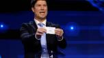 Danish Former footballer Brian Laudrup holds up a slip of paper after drawing Italy from the pot during the final draw for the UEFA Euro 2024 European Championship football competition in Hamburg, northern Germany on December 2, 2023. (Photo by Odd ANDERSEN / AFP)