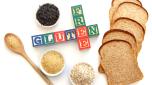 Gluten free products around block letters, including wild rice, oats and bread