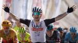 epa10466400 Italian rider Diego Ulissi of Uae Team Emirates celebrates while crossing the finish line to win the 4th stage of the Tour of Oman cycling race over 204.9 km from Izki to Yitti Hills, Oman, 14 February 2023.  EPA/YOAN VALAT