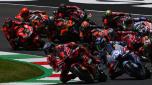 Pack of riders compete at the start of the race during the Italian MotoGP race at Mugello Circuit in Mugello, on June 11, 2023. (Photo by Filippo MONTEFORTE / AFP)