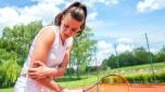 Elbow injury in tennis, unpleasant facial expression, arm injury