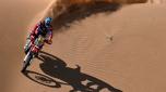 TOPSHOT - Monster Energy Honda Team's Chilean biker Jose Ignacio Cornejo Florimo rides his bike in the dunes as he competes during Stage 3 of the Dakar Rally 2024, between Al Duwadimi and Al Salamiya, Saudi Arabia, on January 8, 2024. (Photo by PATRICK HERTZOG / AFP)