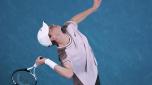 Jannik Sinner of Italy serves to Andrey Rublev of Russia during their quarterfinal match at the Australian Open tennis championships at Melbourne Park, Melbourne, Australia, Tuesday, Jan. 23, 2024. (AP Photo/Louise Delmotte)