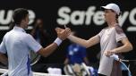 Jannik Sinner, right, of Italy is congratulated by Novak Djokovic of Serbia following their semifinal at the Australian Open tennis championships at Melbourne Park, Melbourne, Australia, Friday, Jan. 26, 2024. (AP Photo/Alessandra Tarantino)
