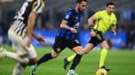 MILAN, ITALY - FEBRUARY 04:  Hakan Calhanoglu of FC Internazionale in action during the Serie A TIM match between FC Internazionale and Juventus - Serie A TIM  at Stadio Giuseppe Meazza on February 04, 2024 in Milan, Italy. (Photo by Mattia Pistoia - Inter/Inter via Getty Images)