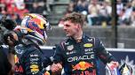 Pole position qualifier Red Bull Racing's Dutch driver Max Verstappen (R) reacts with second-placed qualifier Red Bull Racing's Mexican driver Sergio Perez after the qualifying session for the Formula One Japanese Grand Prix race at the Suzuka circuit in Suzuka, Mie prefecture on April 6, 2024. (Photo by Philip FONG / AFP)