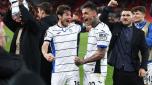 Atalanta's Dutch midfielder #15 Marten de Roon (L) celebrates with Atalanta's Italian forward #90 Gianluca Scamacca after the UEFA Europa League quarter-final first leg football match between Liverpool and Atalanta at Anfield in Liverpool, north west England on April 11, 2024. Atalanta won the match 3-0. (Photo by Darren Staples / AFP)