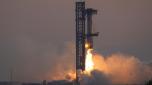 SpaceX's mega rocket booster returns to the launch pad to be captured during a test flight Sunday, Oct. 13, 2024, in Boca Chica,, Texas. (AP Photo/Eric Gay)